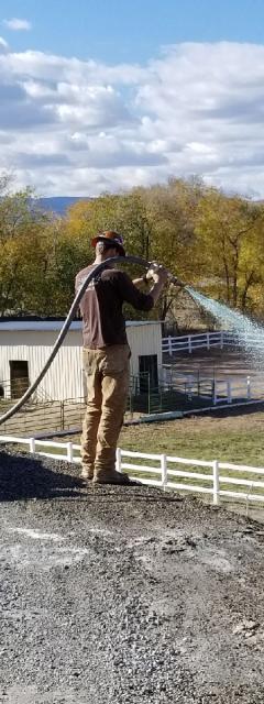 Hydro seeding a hillside for an irrigation district project.